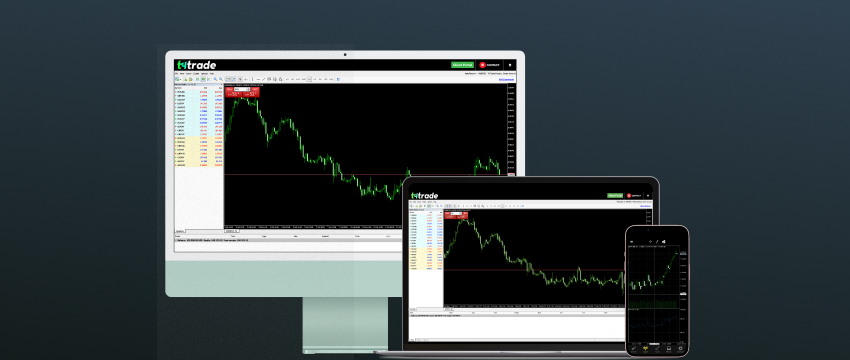 A desktop, laptop, and smartphone display the same trading software interface, featuring a fluctuating line graph with colorful indicators on a dark screen.