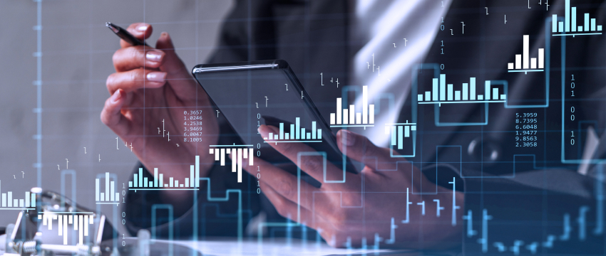 Businessman using a smartphone and tablet to assess financial data for forex trading and risk management analysis.